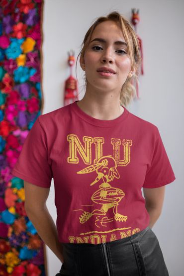 Young woman wearing a red NIU Indians t-shirt and black leather skirt.