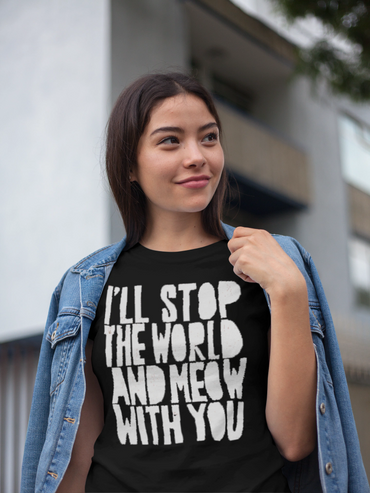 Young woman wearing a black T-shirt with a playful message and a denim jacket.