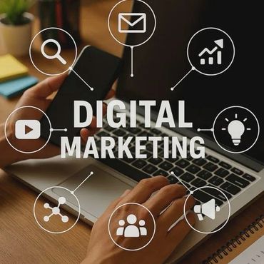 Person using laptop and smartphone with digital marketing icons around.