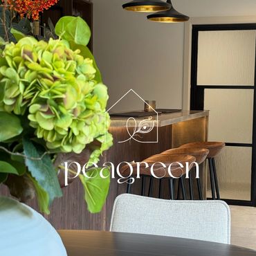 Elegant indoor bar area with green floral centerpiece and modern seating.