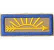 Arrow of Light patch.  A light brown patch with a blue border and a right-facing arrow with sunbeams