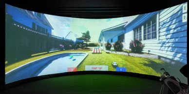 Virtual golf simulator with corn hole loaded