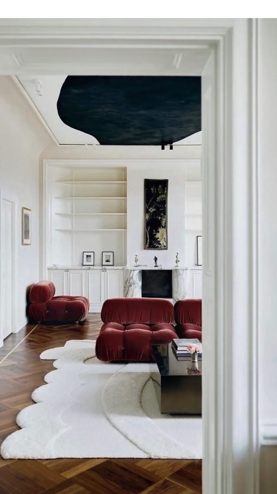 vintage sofa chair velvet cushy luxury vibe 70s 80s white black bold ceiling statement graphic rug