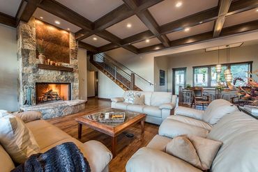 modern living room with large stone fireplace