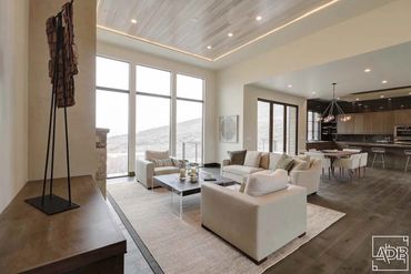 modern white living room with stone fireplace
