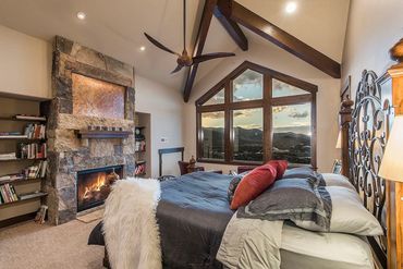 guest room with stone fireplace