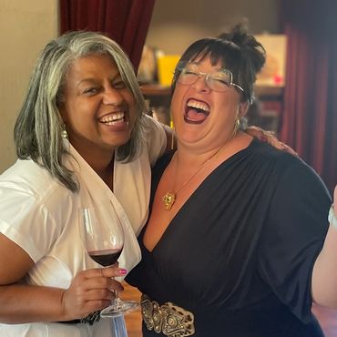 Greer and Wine Educator, Che, enjoy a laugh outside one of the private tasting rooms.