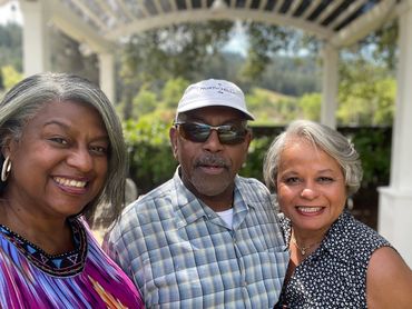 Greer and two friends visiting from the East Coast under the pergola.