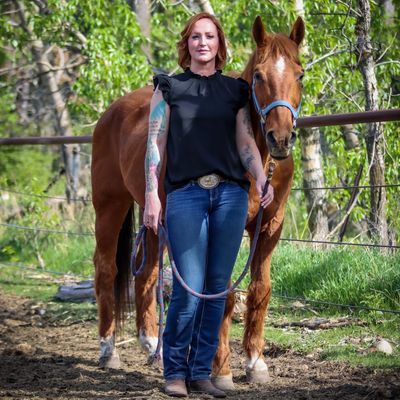 woman standing with a horse