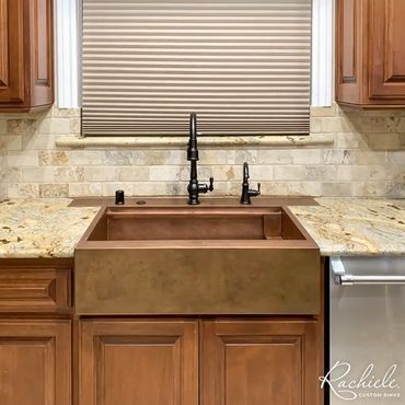 Custom Copper farmhouse workstation sink with a custom back deck to fix cracked granite.