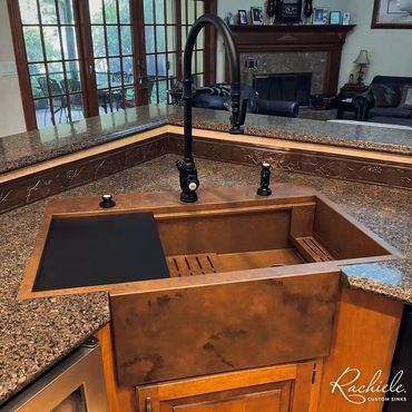 36" custom retrofit farmhouse workstation sink by Rachiele that replaced a double bowl sink.