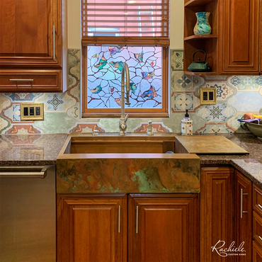 36" custom workstation farmhouse sink by Rachiele with a custom patina