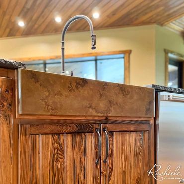 36" copper farmhouse workstation sink by Rachiele with a custom earth tone patina