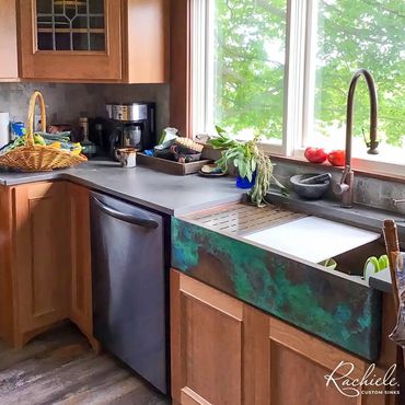 36" copper farmhouse sink with a custom patina and Waterstone faucet in American Bronze