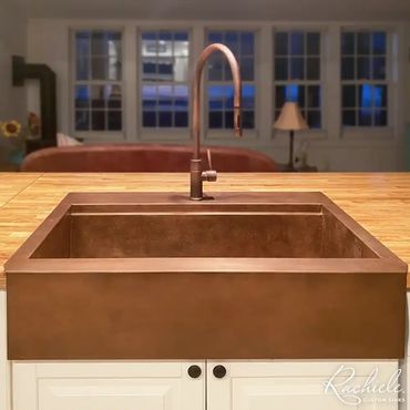 retrofit farm sink by Rachiele in copper on wooden countertop that replaced an Ikea sink