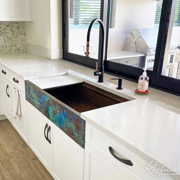 42" copper farmhouse sink with workstation by Rachiele and a Waterstone split finish faucet