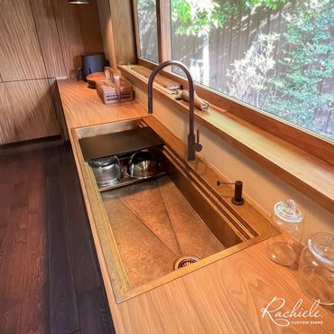 53" Custom Bronze drop in kitchen sink by Rachiele in a modern kitchen with Waterstone faucet