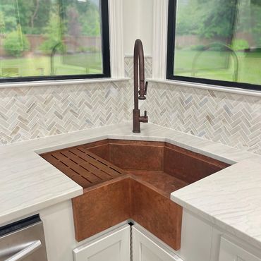 Custom copper apron front single bowl workstation corner sink with Waterstone 9750 AMB faucet