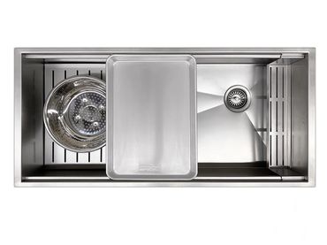 Custom workstation kitchen sinks that are designed to allow halft sheet pans to sit next to