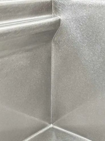 MicroWelding shown on a Rachiele inside corner on a stainless sink