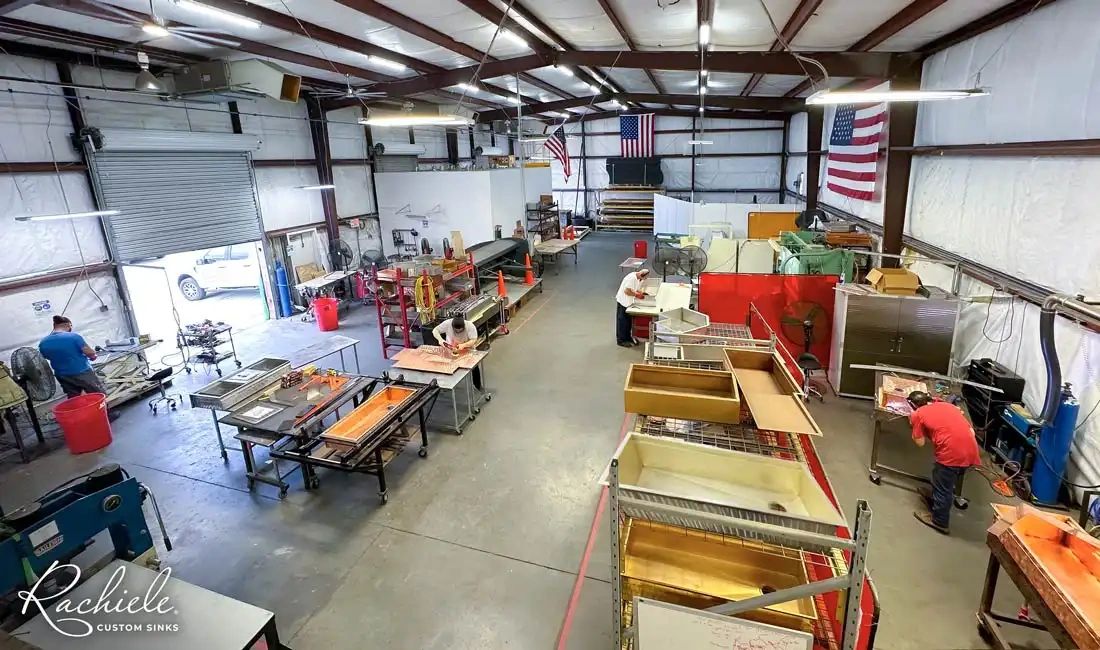 Overhead view of artisans handcrafting custom sinks at Rachiele's USA workshop in Apopka, FL.