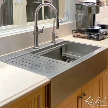 Stainless steel drop in farmhouse workstation sink by Rachiele that fits over existing cabinets.