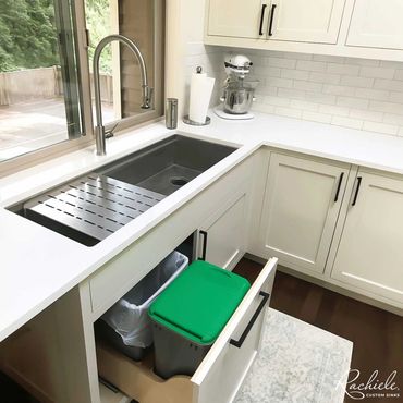 36 inch rachiele workstation under mount sink with dual pull out trash bins below.