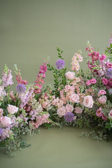 pink and purple brand activation birthday bridal shower baby shower grounded flower installation