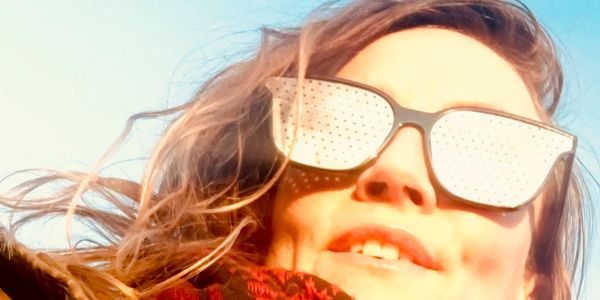 color photo of woman wearing Faraday sunglasses.