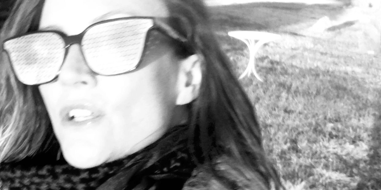 black and white photo of woman wearing Faraday sunglasses