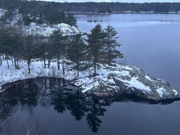 A peaceful winter shoreline overlooking Georgian Bay, inviting stillness, reflection, and quiet pres