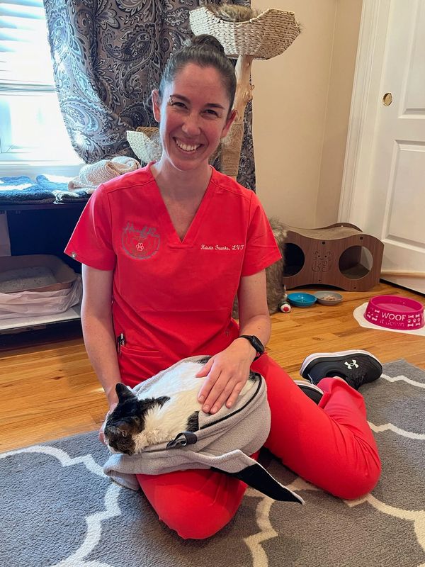 vet smiling with cat