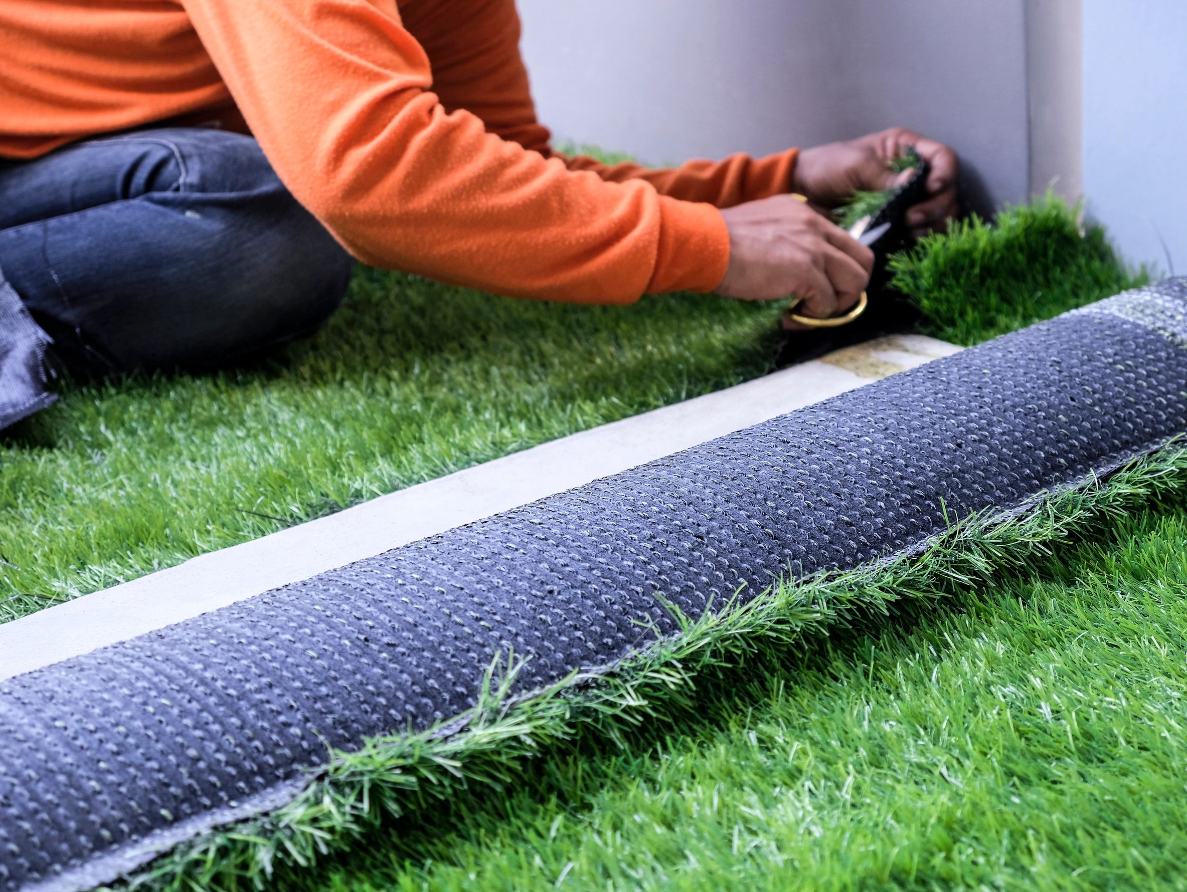 Professional installation of synthetic lawn turf