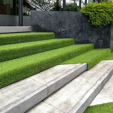 Synthetic turf highlights on stone landscape display