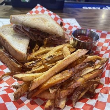 Beef and Cheese sandwich with French fries at Arrowhead