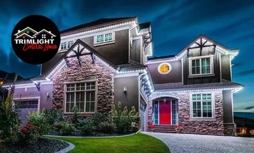 A home pictured at night with Trimlight accent lighting.