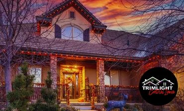 A home decorated for autumn shows an orange themed Trimlight pattern.