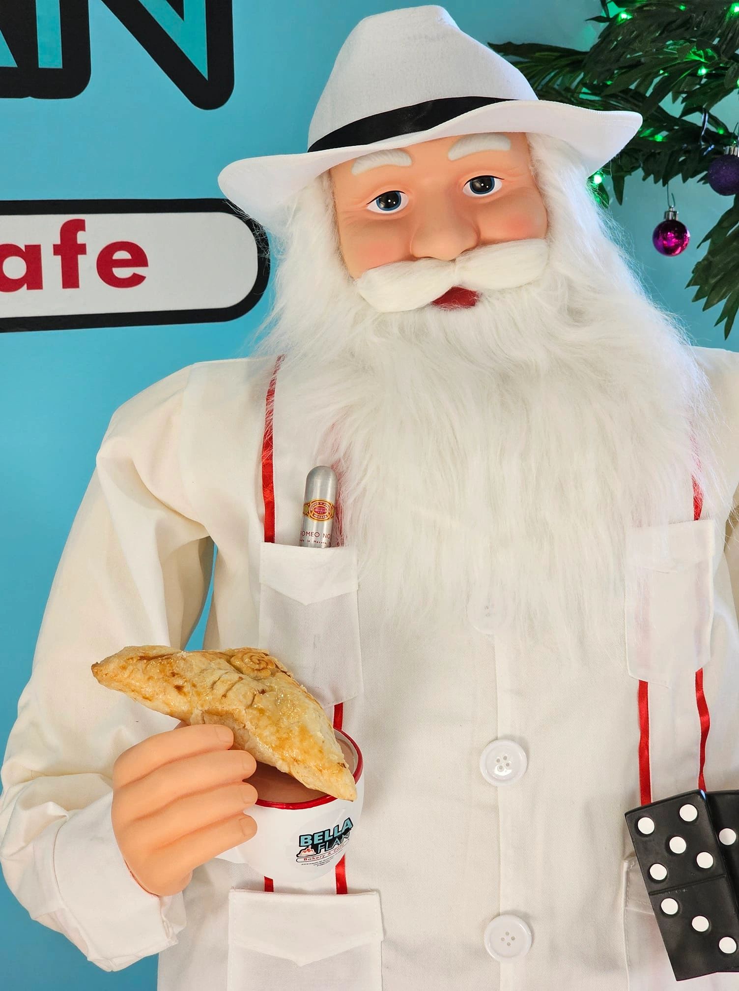 Cuban Santa eating a pastelito at Bella Flan