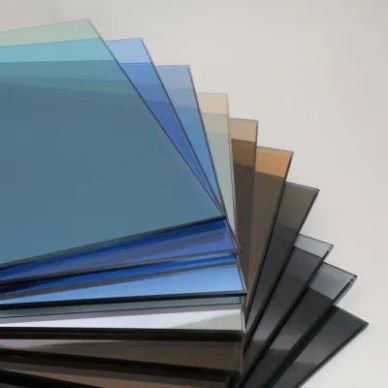 Stack of colored tinted glass panels arranged in a fan shape.