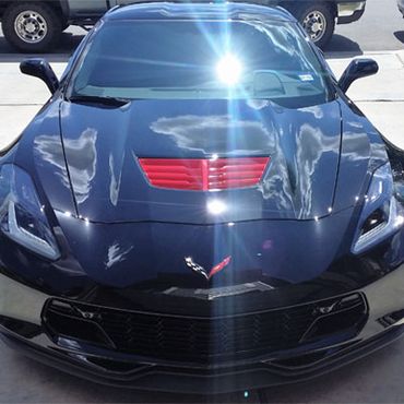 Black Corvette ceramic coated by tint pros, photo of front end shine