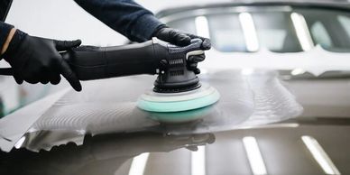 Photo of Tint Pros machine polishing a hood of a car