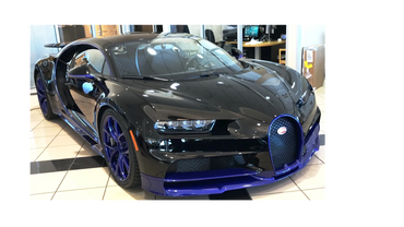 Picture of a Bugatti Completely wrapped in Clear bra by Tint Pros. also interior ceramic coating