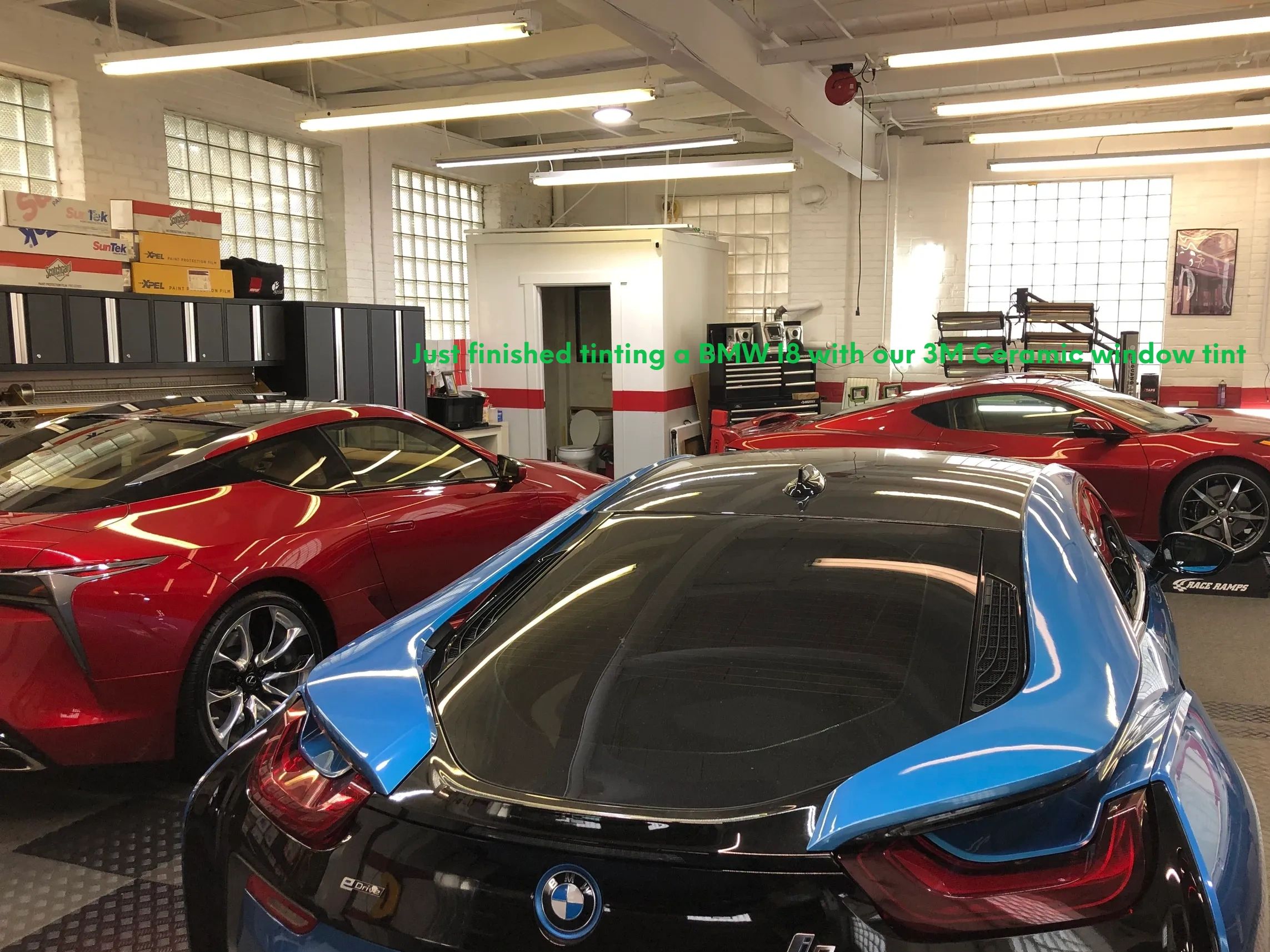 BMW I8, Lexus LC 500 and a corvette being worked on inside Tint Pros Cleveland