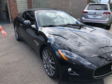 Black Maserati Ceramic Coated parked outside of Tint Pros Cleveland