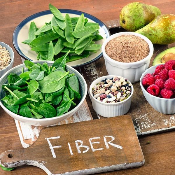 Various high-fiber foods with sign.