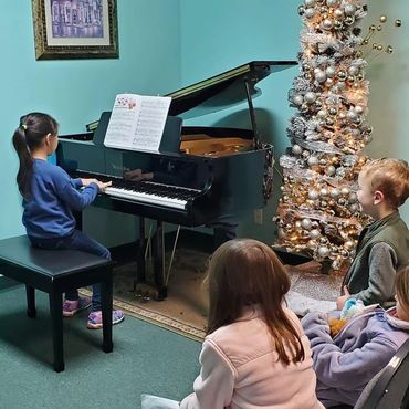 Piano performances help students learn to share the skills they are learning and the joy of music.