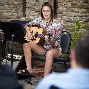 Singing and playing the guitar for others is a much appreciated skill.