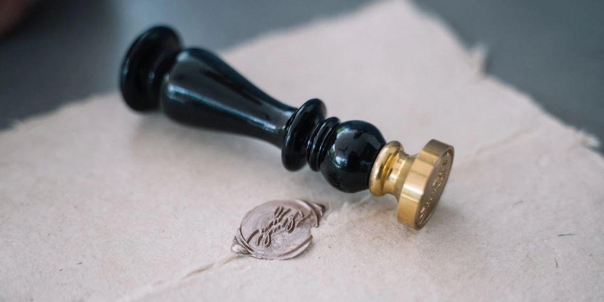 Gold seal representing a licensed and insured vending company
