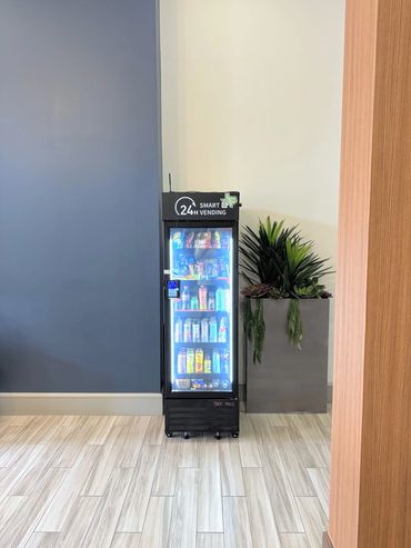 Branded Quick S-Mart smart vending machine in an apartment lobby