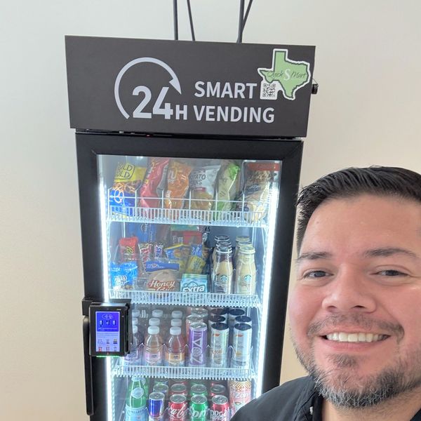 Noé, co-owner of Quick S-Mart, next to one of the company's smart vending machines
